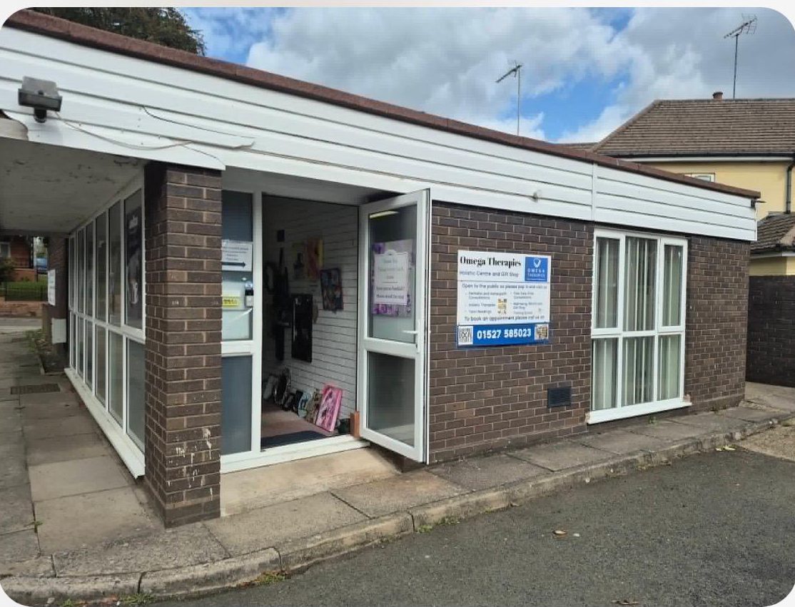 Newton House at 51 Bromsgrove Road, Redditch, the low brick building signed Omega Therapies Holistic Centre and Gift Shop where the Theorem Health physiotherapy clinic is held