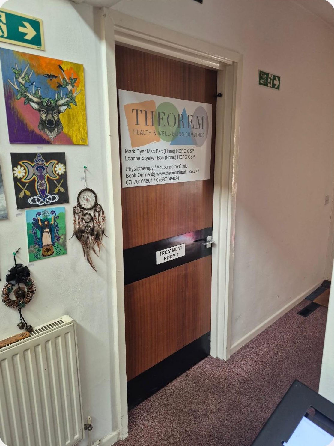 A wooden door signed Treatment Room 1, with a Theorem Health and Wellness nameplate naming the physiotherapists who work there